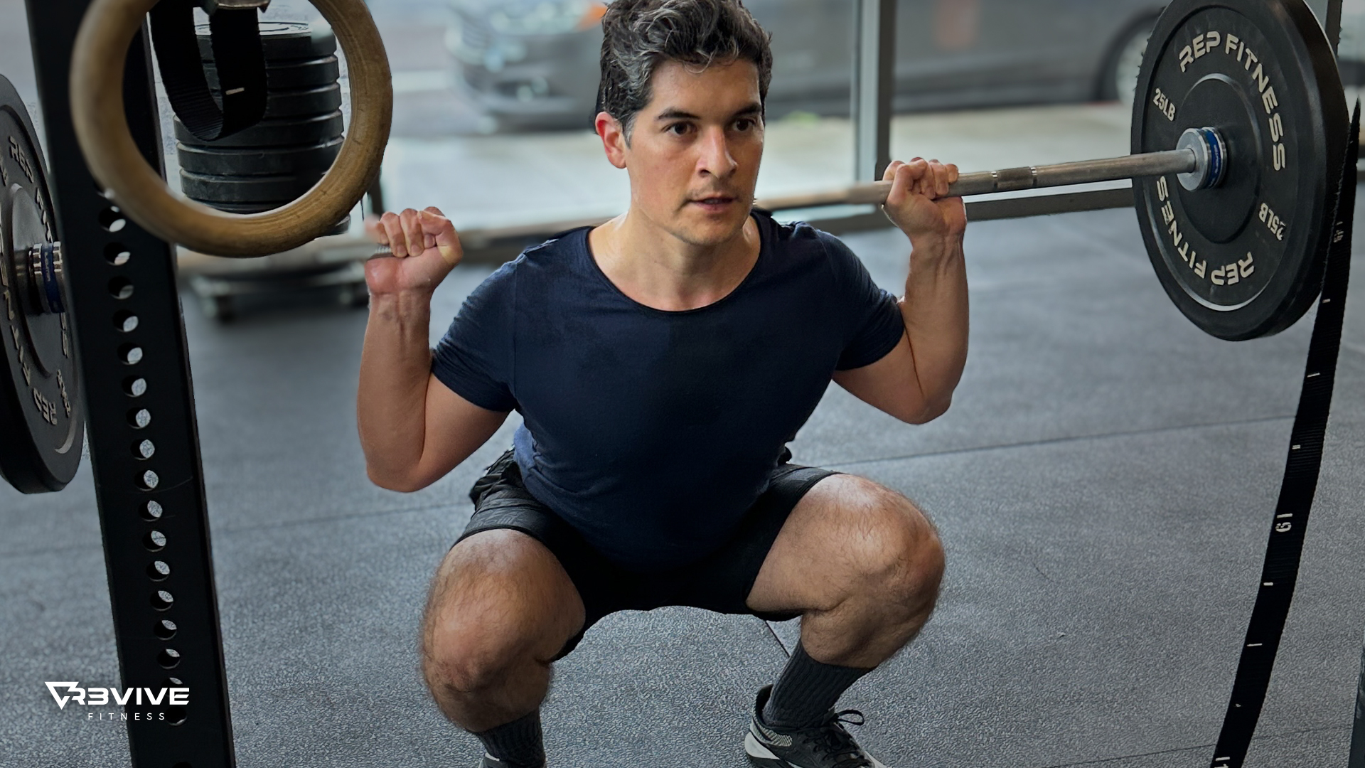An athlete performing a back squat at a controlled "Tempo"